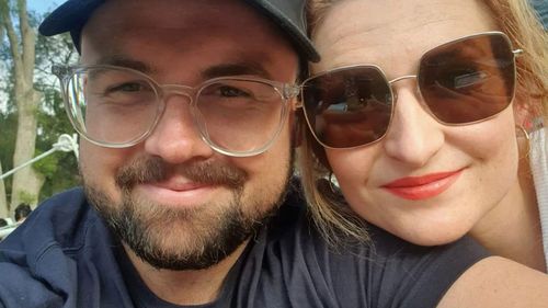 Constable Anthony Woods with his wife, Emily.