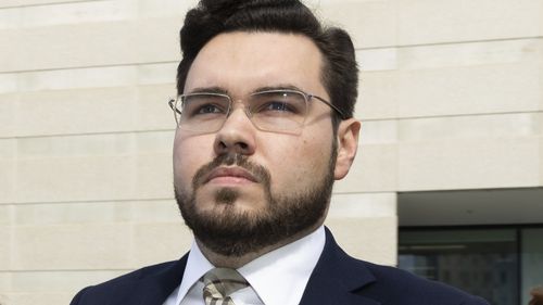 Bruce Lehrmann (centre) departs ACT supreme court on Wednesday 19 October 2022. 
