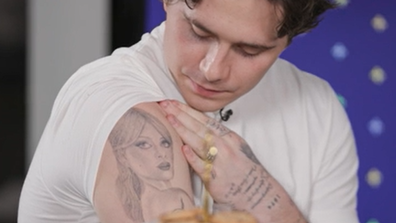 Brooklyn Beckham shows off his new portrait tattoo of his wife, Nicola Peltz Beckham.