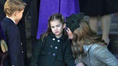 Catherine, Duchess of Cambridge speaks to Princess Charlotte as Prince George watches as they leave after attending the Christmas Day Church service at Church of St Mary Magdalene on the Sandringham estate on December 25, 2019 in King's Lynn, United Kingdom