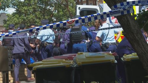 Police have stormed a unit and arrested a man after an hour of negotiations following a stabbing in western Sydney.