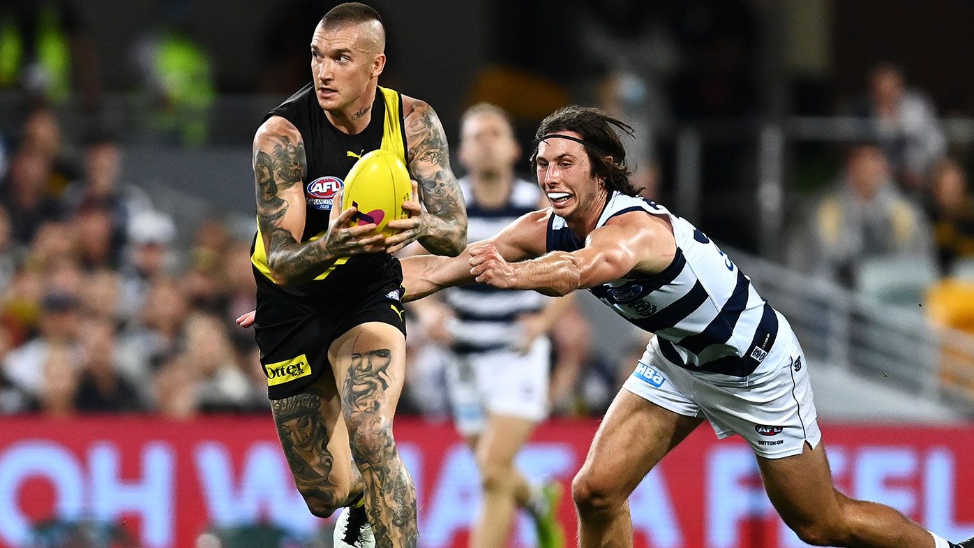  Dustin Martin of the Tigers runs the ball during the 2020 AFL Grand Final match between the Richmond Tigers and the Geelong Cats at The Gabba on October 24, 2020 in Brisbane, Australia. (Photo by Quinn Rooney/Getty Images)
