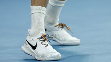 Liam Broady&#x27;s rainbow shoe laces are seen in his round one singles match against Nick Kyrgios.