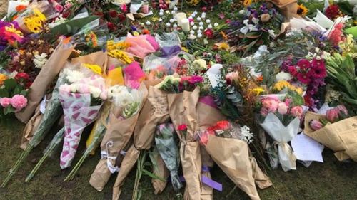 Floral tributes for just one of many women killed at random.