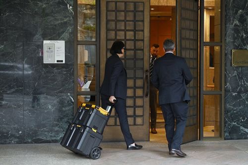 NSW Detectives arrive at 1 Macquarie Street in Circular Quay during the arrest of Alan Jones. Sydney, NSW. November 18, 2024. Photo: 