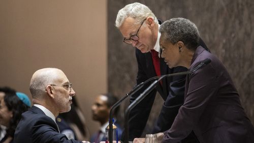 Mayor Lori Lightfoot chats with Corporation Counsel Mark Flessner (center) and Deputy Corporation Counsel Jeff Levine (left) during her first Chicago City Council meeting at City Hall, Wednesday, May 29, 2019. | Ashlee Rezin/Sun-Times