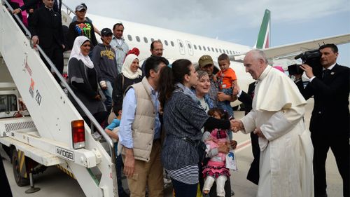 Pope Francis brings three Syrian refugee families back to Rome with him after visiting Greek migrant camp