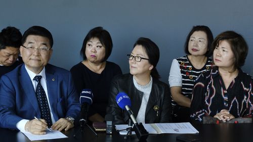 Bernard J. Lim( left) from the Korean Friendship Bell Preservation Committee and Youngmi YI, (centre) with Myung Won Cultural Foundation  answer questions during a news conference in LA's Koreatown.