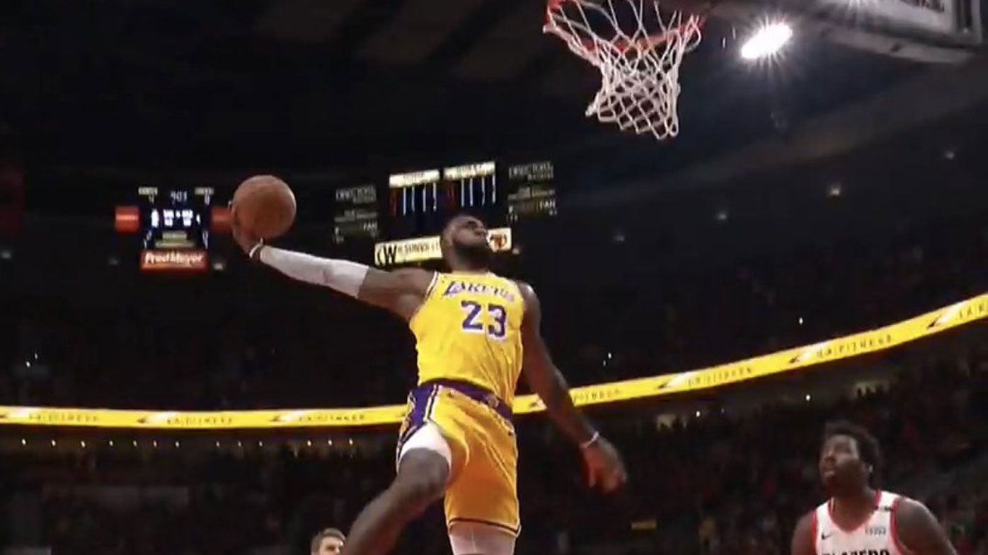 LeBron James starts life as a LA Laker with stunning double dunks