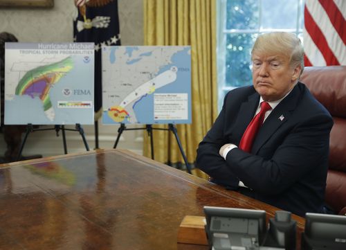 President Donald Trump pauses during his meeting to discuss potential damage from Hurricane Michael, in the Oval Office of the White House 
