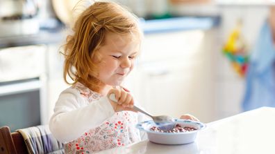 Toddler eating cereal 
