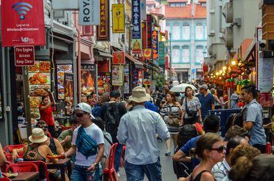 People shopping and eating in Chinatown - Singapore