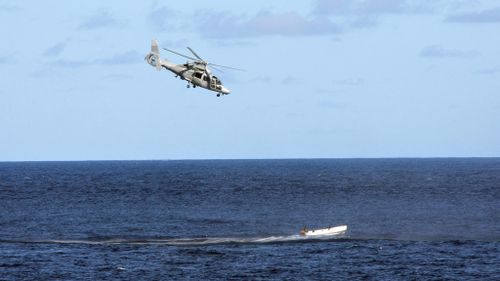 A French Navy "Panther" helicopter chases a boat carrying suspected Somali pirates on May 3, 2009. (AFP)