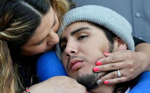 One of the victims of the Ethan Couch drink driving incident, Sergio Molina, right, is hugged by his mother Maria Lemus at a court hearing in 2016. (AP).