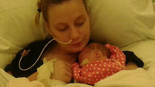 Mother wakes from coma to discover she has a seven-week-old baby girl