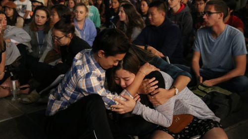 Students at a vigil at the University of Nevada. (AAP)