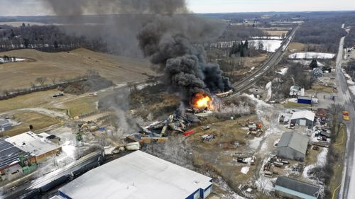 This photo taken with a drone shows portions of a Norfolk and Southern freight train that derailed Friday night in East Palestine, Ohio are still on fire at mid-day Saturday, Feb. 4, 2023.  