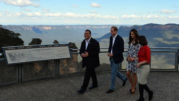 Prince William and his wife Catherine, the Duchess of Cambridge, visit the Three Sisters with Randal Walker (L) and Anthea Hammon (R) in April, 2014 (Getty).