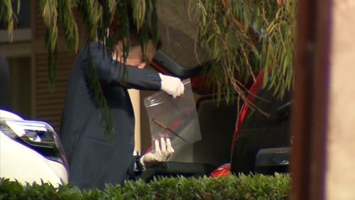 Police have removed a knife from the boot of a car at the Walsh residence, but it is unknown if it was used in the alleged murder. (9NEWS)