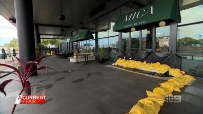 The floodwaters lapped at the door of his cafe Mica on the banks of Breakfast Creek but sandbags kept it mostly dry.