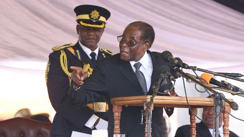 Zimbabwe President Robert Mugabe delivers a speech during the burial of liberation war hero Don Muvuti at the national heroes acre in Harare, Zimbabwe on 1 November, 2017. (AAP)