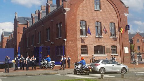 Police secure the area around a police building in the southern Belgian city of Charleroi following a machete attack. (AFP)