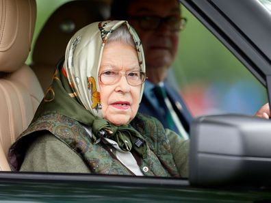 Queen Elizabeth driving a car.