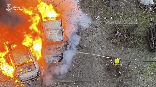 Emergency services personnel work to extinguish a fire after a Russian missile attack in the Poltava region of Ukraine, Sunday, November 17, 2024.  