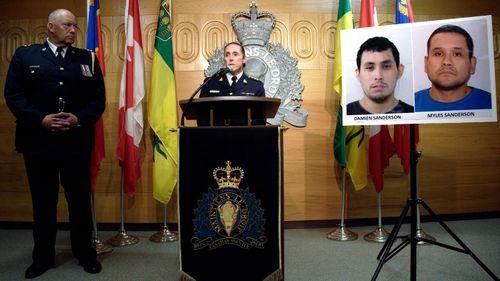 Assistant Commissioner Rhonda Blackmore speaks while Regina Police Chief Evan Bray looks on during a press conference at RCMP "F" Division Headquarters in Regina, Saskatchewan