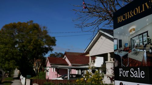 A real estate sign is seen at a property in Croydon Park in Sydney, Australia