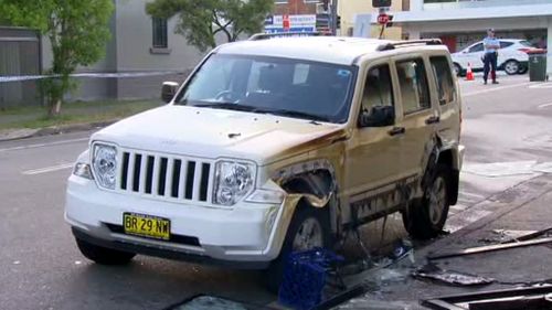 A car outside the store was also damaged. (9NEWS)