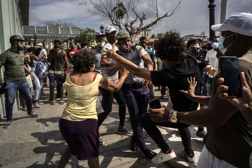 Hundreds of demonstrators went out to the streets in several cities in Cuba to protest against ongoing food shortages and high prices of foodstuffs, amid the new coronavirus crisis. (AP Photo/Ramon Espinosa)