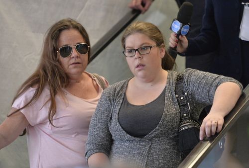 Cassie Sainsbury's mother Lisa (left)  and sister Khala arrive back at Adelaide airport last year. (AAP)
