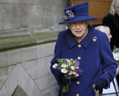 Britain's Queen Elizabeth II, Patron, holds flowers as she leaves after attending a Service of Thanksgiving to mark the Centenary of the Royal British Legion at Westminster Abbey, in London, Tuesday, Oct. 12, 2021. (AP Photo/Frank Augstein, Pool)