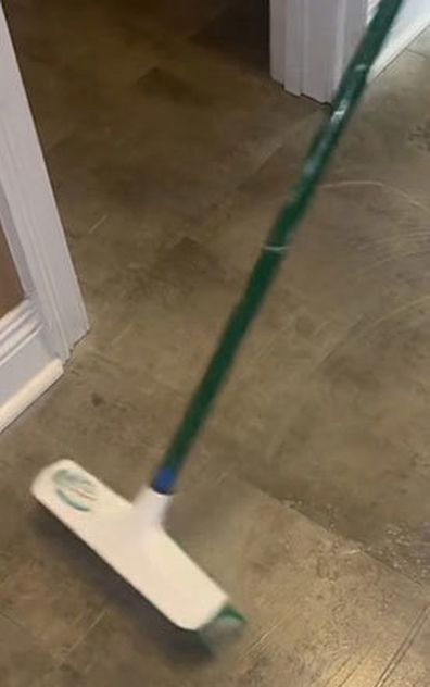 Cleaner transforms filthy floor using a broom hack before mopping.