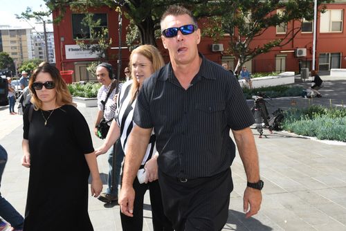 Stephen Grimmer, the brother of murdered toddler Cheryl Grimmer who went missing 47 years ago, with his niece Melanie (left) and partner Carrie (centre) leaving the Wollongong local court. Picture: 9NEWS