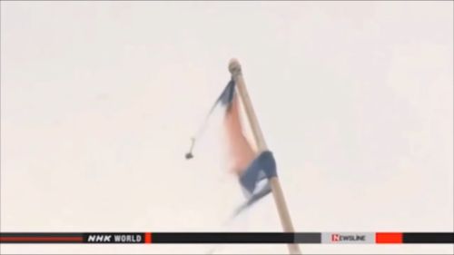 The remains of what appears to be a North Korean flag. (NHK)