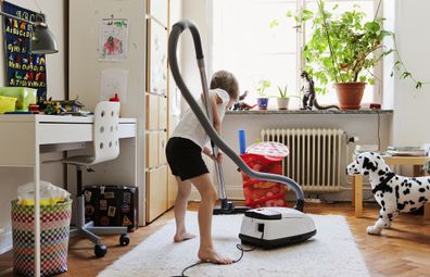 Boy vacuuming