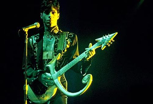 Prince with a Love Symbol No.2 guitar in 1995 (Getty)