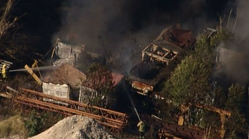 A blaze consumes an industrial state near Penrith, in Sydney's West. (9NEWS)