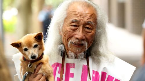 Sydney activist Danny Lim is seen outside of Sydney City Police Area Command, Sydney, Sunday, January 13, 2019. Protestors have gathered to rally against what they say is the brutal arrest of well known Sydney activist Danny Lim, who is 74 years old