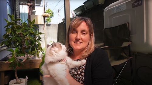 Chani, pictured with her cat Millie. Typical of many Japanese homes, Chani's house only has a very small outdoor area.