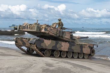 An Australian Army M1A1 Abrams Main Battle Tank from the 2nd Cavalry Regiment lands on the beach