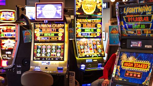 Pokie machines in a gaming room.