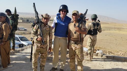 Peter Stefanovic pictured with peshmerga soldiers on the outskirts of Mosul, Iraq. (9NEWS)