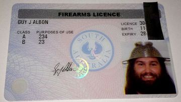 Adelaide man Guy Albon successfully had his gun licence printed with a photo of him wearing a colander. (Supplied)