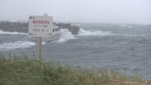 Two-three metre surf will continue to lash the coast. (9NEWS)