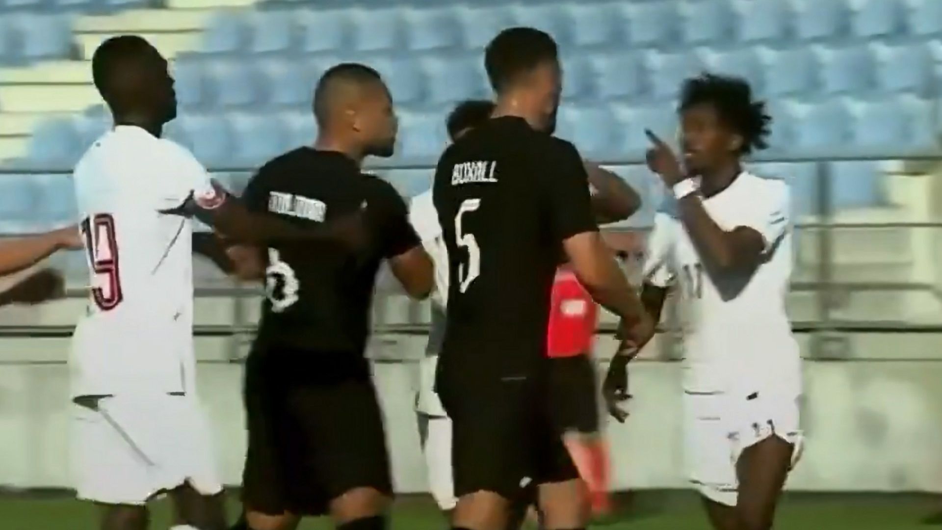 New Zealand&#x27;s Michael Boxall is taunted by a Qatari player in an international friendly.