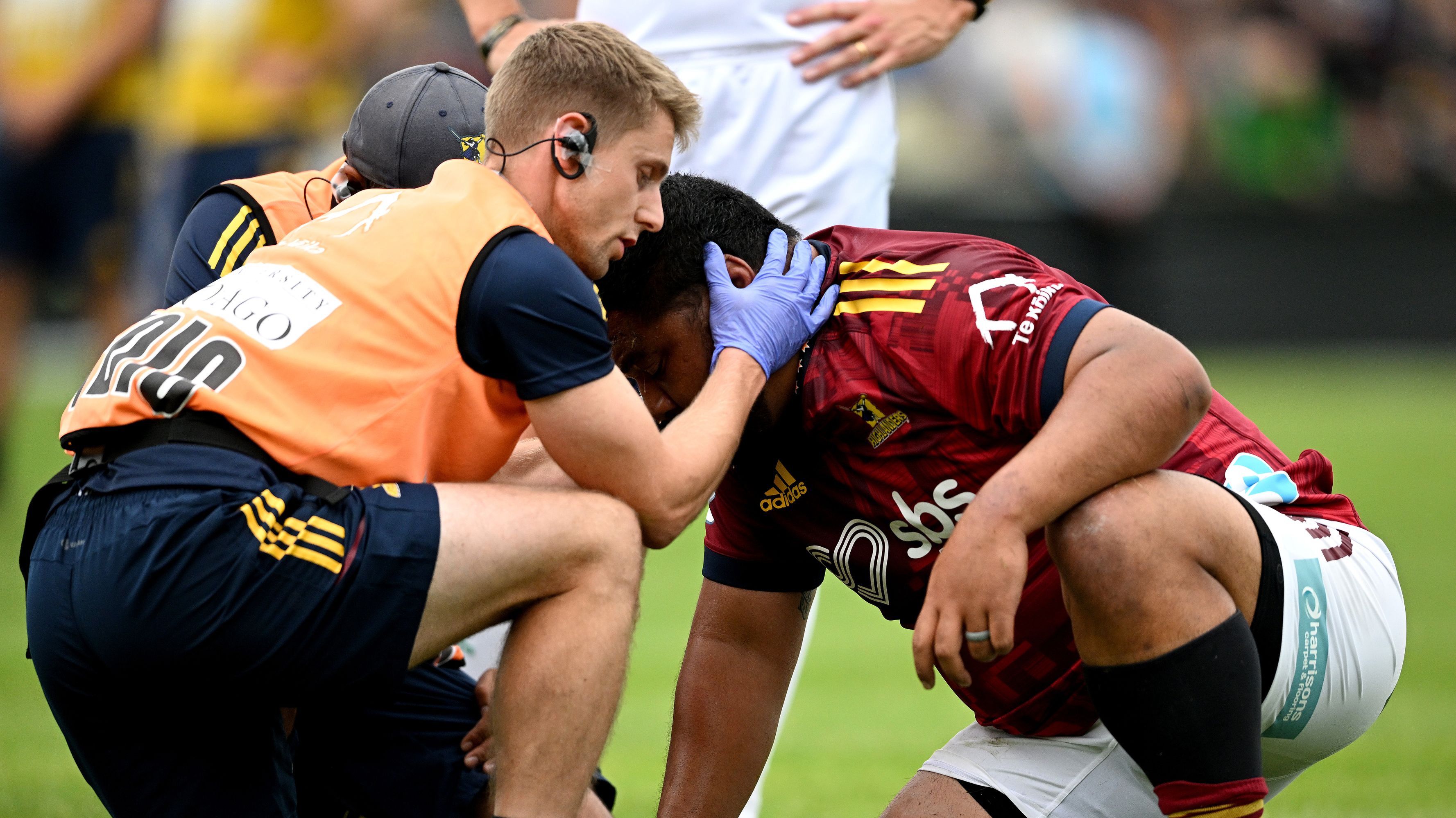 Andrew Makalio receives medical attention during the round four Super Rugby Pacific match between Highlanders and Western Force.