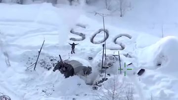 Tyson Steele is seen in this aerial photo, taken from Alaska State Troopers&#x27; footage. Steele, who is from Utah, was rescued from the Alaskan wilderness, approximately three weeks after a fire burned his home to the ground, leaving him without much food, clothing or shelter and killing his beloved dog.